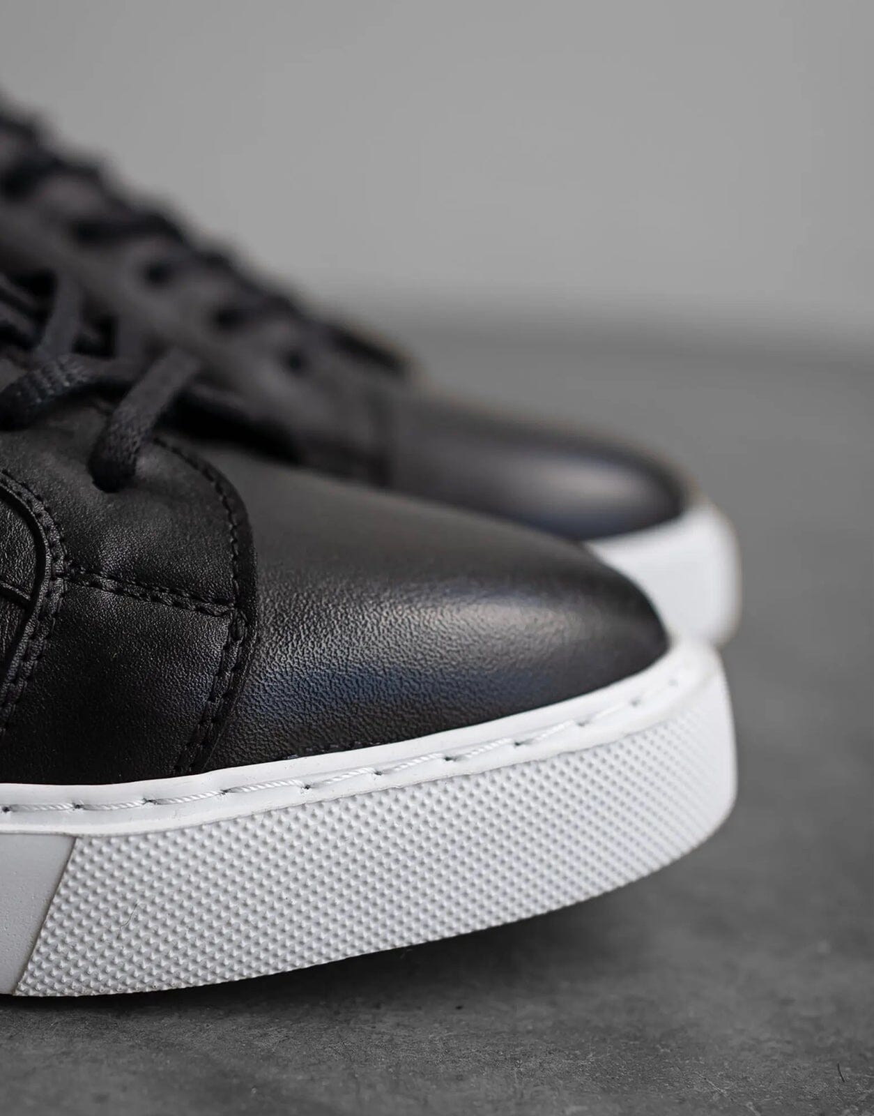 Black and sales white leather sneakers